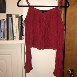 Red off the shoulder long sleeved knit top
